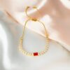 Whats-App-Image-2022-11-25-at-10-36-27.jpg Pulseira Riviera Baguete com Zircônia Rubi, Banhado a Ouro